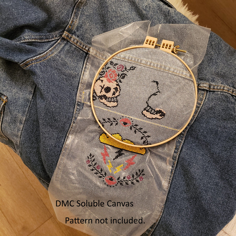 DMC soluble canvas being used on a jean jacket